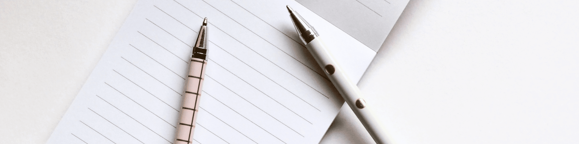 pencils and paper on a table - business writing